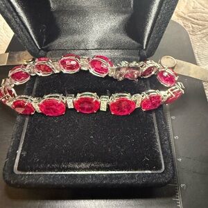 Tennis bracelet in 14k white gold and 40 carat lab rubies.